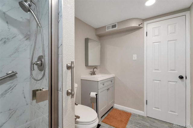 8280 Auburn Ln, Westminster, CO 80031 - bathroom with a marble finish shower, vanity, and wood finished floors