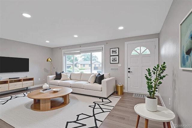 8280 Auburn Ln, Westminster, CO 80031 - living area featuring plenty of natural light, wood finished floors, and recessed lighting