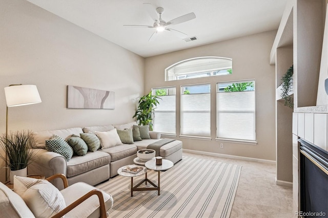2870 W Riverwalk Cir Unit B, Littleton, CO 80123 - living room with light colored carpet, ceiling fan, and a fireplace