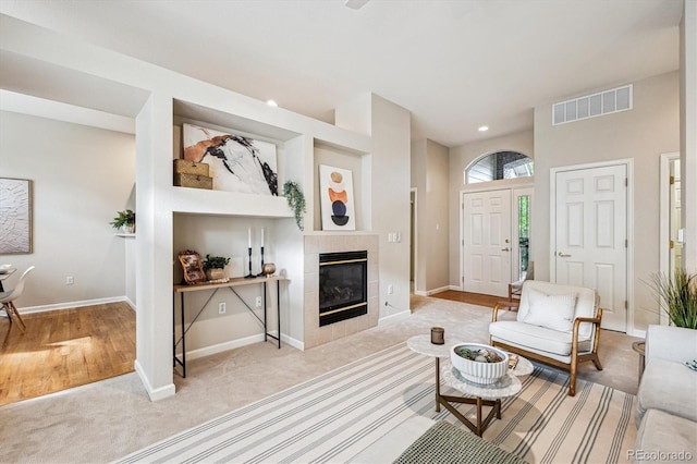 2870 W Riverwalk Cir Unit B, Littleton, CO 80123 - living area featuring carpet flooring, a fireplace, and recessed lighting