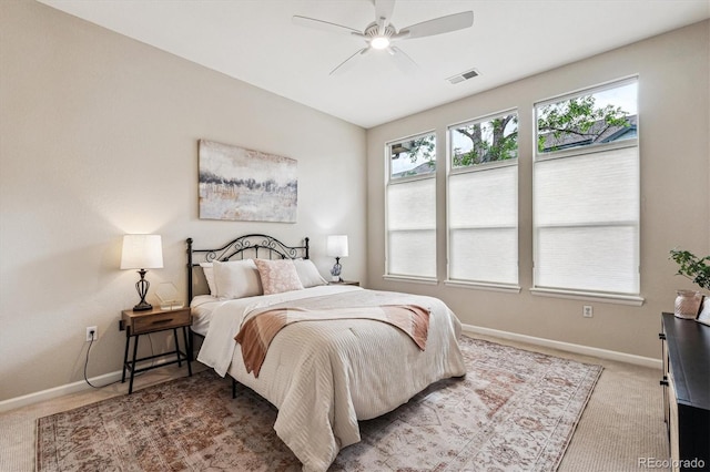 2870 W Riverwalk Cir Unit B, Littleton, CO 80123 - carpeted bedroom featuring multiple windows and a ceiling fan