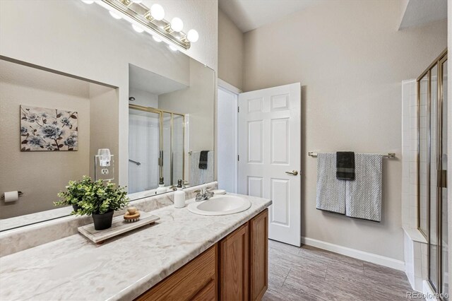 2870 W Riverwalk Cir Unit B, Littleton, CO 80123 - full bathroom with a stall shower and vanity
