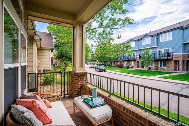 2870 W Riverwalk Cir Unit B, Littleton, CO 80123 - porch featuring a residential view