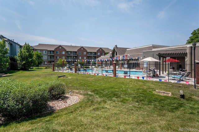 2870 W Riverwalk Cir Unit B, Littleton, CO 80123 - view of yard featuring a community pool and a residential view