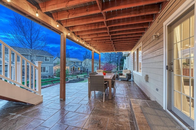 view of patio / terrace featuring stairway, an outdoor living space, and outdoor dining area