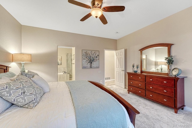 carpeted bedroom featuring baseboards, visible vents, a ceiling fan, and connected bathroom