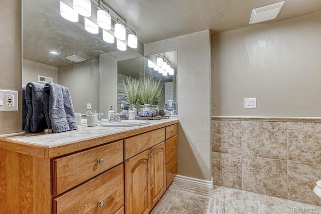 bathroom featuring vanity, tile patterned flooring, and visible vents