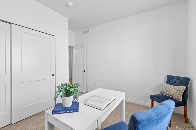office featuring light carpet and baseboards