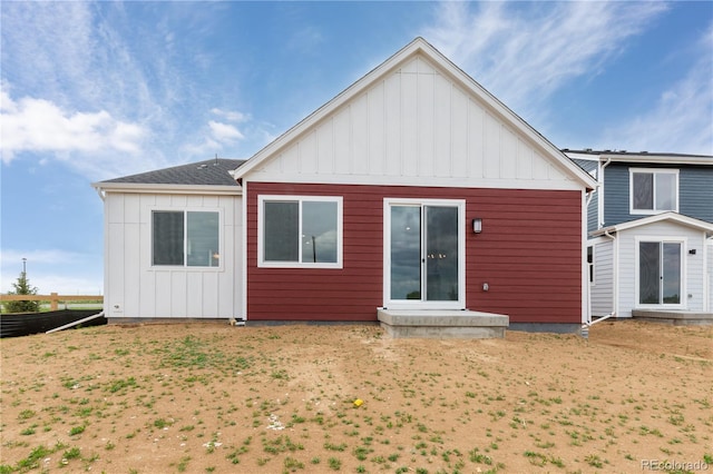 rear view of house with board and batten siding