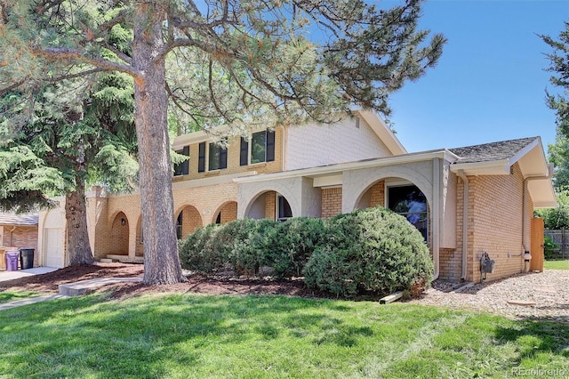 7504 E Jefferson Dr, Denver, CO 80237 - view of front facade with brick siding and a front lawn