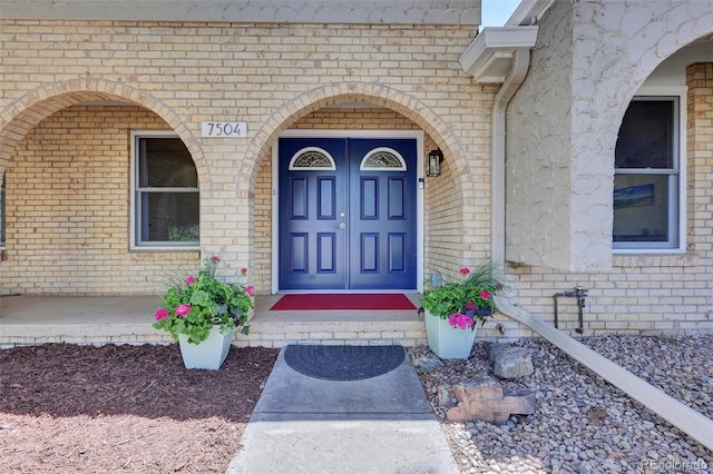 7504 E Jefferson Dr, Denver, CO 80237 - entrance to property featuring brick siding and a porch