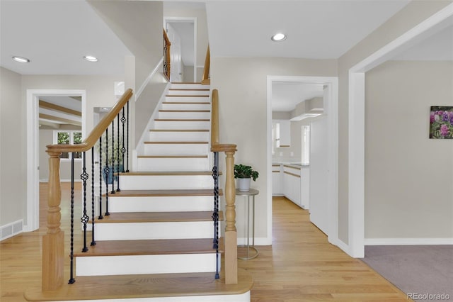 7504 E Jefferson Dr, Denver, CO 80237 - staircase with recessed lighting, baseboards, and wood finished floors