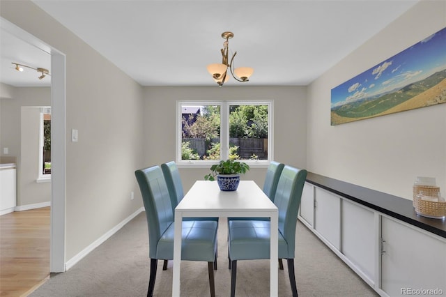 7504 E Jefferson Dr, Denver, CO 80237 - dining space featuring baseboards and light colored carpet
