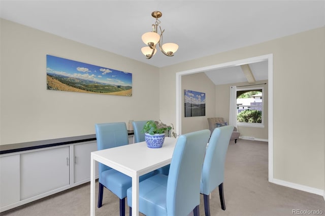 7504 E Jefferson Dr, Denver, CO 80237 - dining area with light colored carpet, baseboards, a chandelier, and lofted ceiling