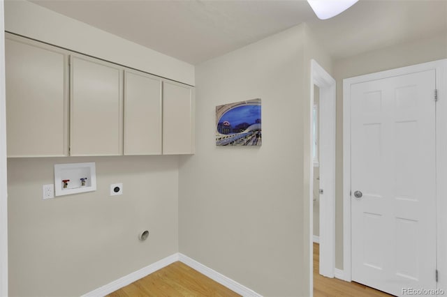 7504 E Jefferson Dr, Denver, CO 80237 - washroom with washer hookup, cabinet space, light wood finished floors, electric dryer hookup, and baseboards