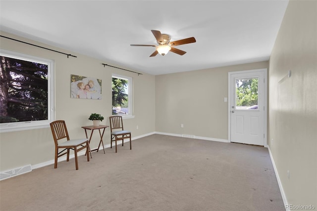 7504 E Jefferson Dr, Denver, CO 80237 - sitting room featuring a ceiling fan, carpet floors, and plenty of natural light