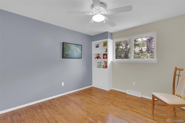 7504 E Jefferson Dr, Denver, CO 80237 - sitting room with wood finished floors, baseboards, and ceiling fan