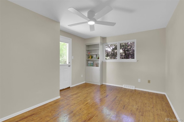 7504 E Jefferson Dr, Denver, CO 80237 - unfurnished room with ceiling fan, wood finished floors, and baseboards