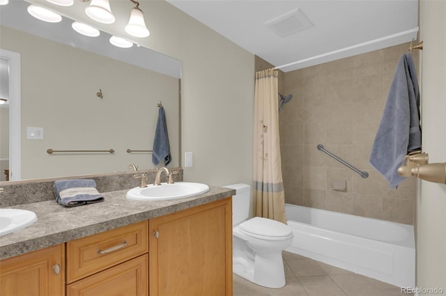 7504 E Jefferson Dr, Denver, CO 80237 - full bath with tile patterned flooring, double vanity, toilet, and shower / tub combo
