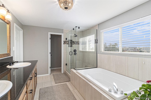 bathroom with tile patterned flooring, vanity, and shower with separate bathtub