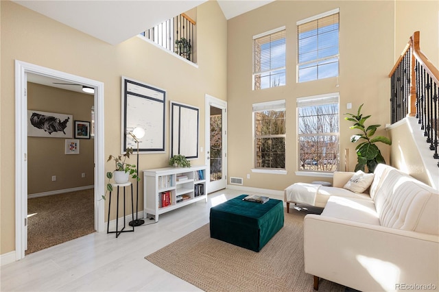 living room featuring a high ceiling