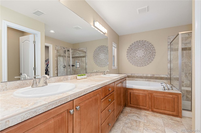 bathroom featuring vanity and shower with separate bathtub