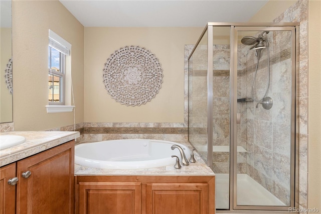 bathroom with vanity and separate shower and tub