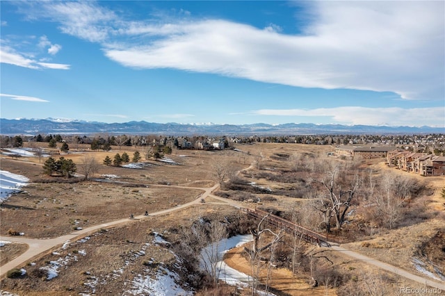 birds eye view of property with a mountain view