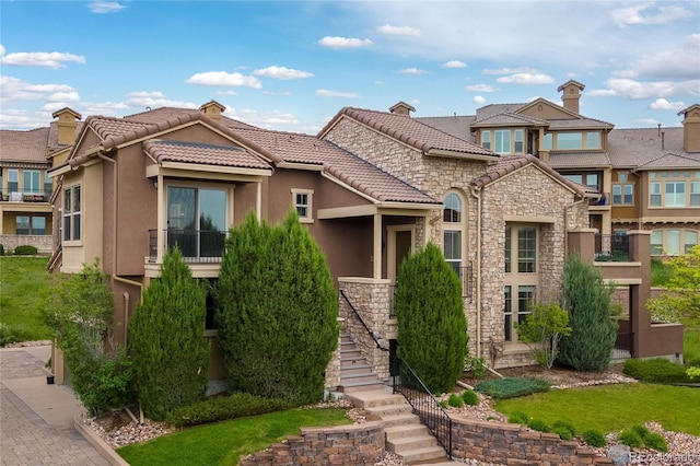 9228 Sori Ln, Highlands Ranch, CO 80126 - view of front of house with stairs, stucco siding, and stone siding