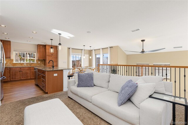 9228 Sori Ln, Highlands Ranch, CO 80126 - living area with healthy amount of natural light, light wood-type flooring, recessed lighting, and ceiling fan