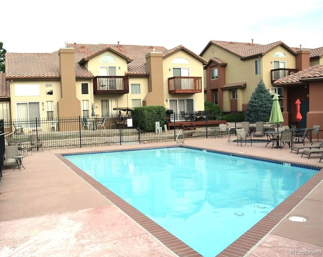 4603 S Abilene Cir, Aurora, CO 80015 - community pool featuring a patio