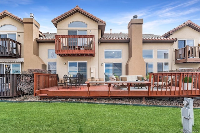 4603 S Abilene Cir, Aurora, CO 80015 - rear view of house featuring a balcony, a chimney, a tile roof, and a yard