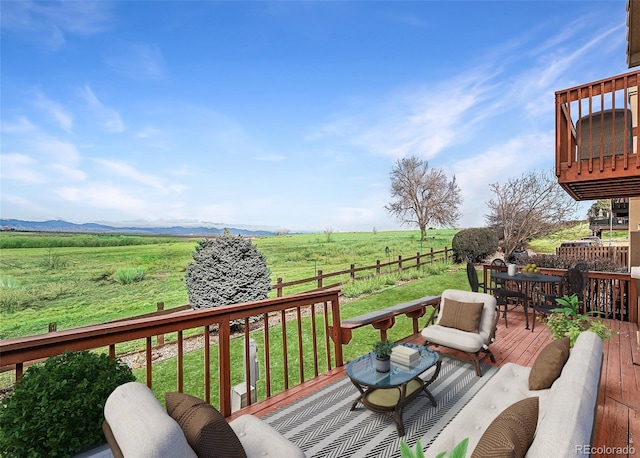 4603 S Abilene Cir, Aurora, CO 80015 - deck with a view of rural / pastoral area, outdoor dining space, and a mountain view
