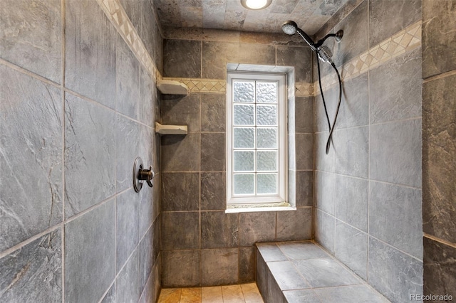 bathroom featuring a tile shower