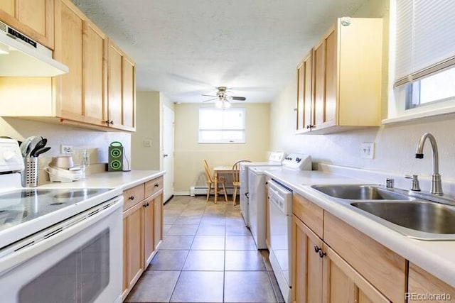 5401 E Warren Ave Unit 105, Denver, CO 80222 - kitchen with white appliances, under cabinet range hood, a baseboard heating unit, light brown cabinets, and ceiling fan