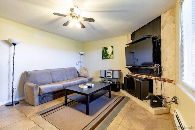 5401 E Warren Ave Unit 105, Denver, CO 80222 - living area with a baseboard heating unit, a ceiling fan, and light tile patterned floors