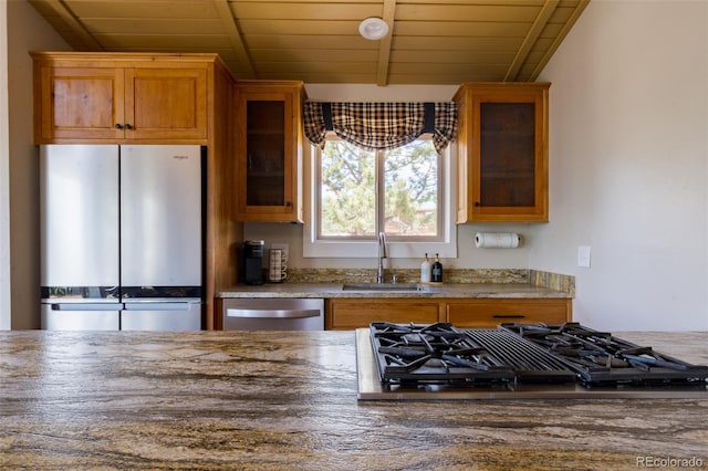 1040 Sheep Ridge Rd, Fairplay, CO 80440 - kitchen featuring appliances with stainless steel finishes, wood ceiling, brown cabinets, glass insert cabinets, and stone countertops