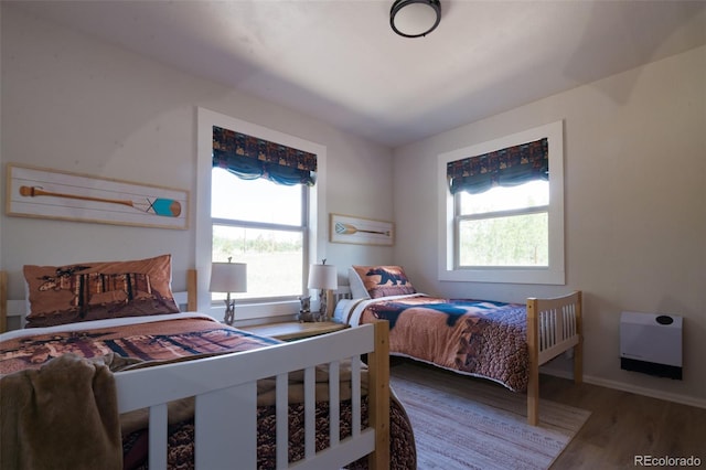 1040 Sheep Ridge Rd, Fairplay, CO 80440 - bedroom featuring multiple windows and wood finished floors