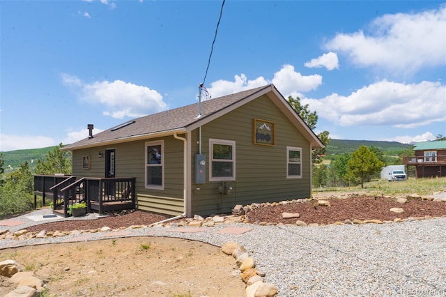 1040 Sheep Ridge Rd, Fairplay, CO 80440 - view of side of property featuring a deck and a shingled roof