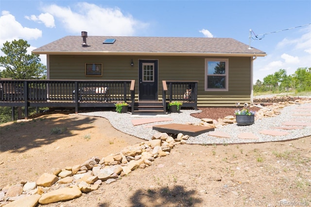 1040 Sheep Ridge Rd, Fairplay, CO 80440 - rear view of house with a wooden deck and roof with shingles