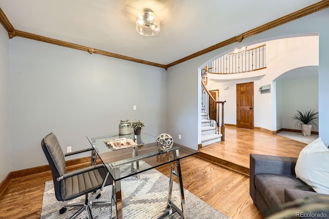 16247 E Belleview Pl, Centennial, CO 80015 - home office featuring arched walkways, ornamental molding, and wood finished floors