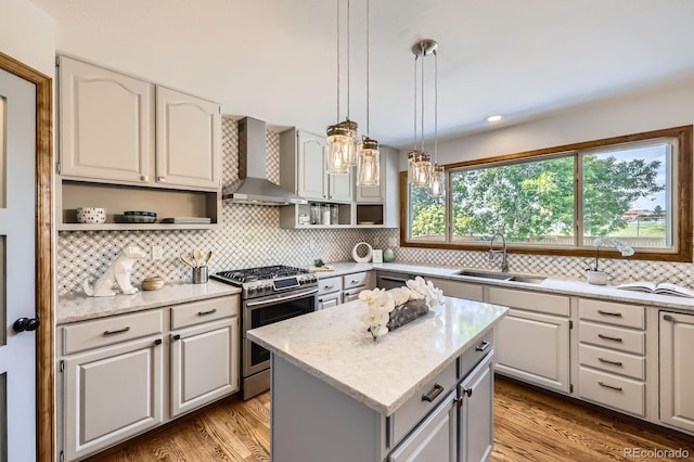 16247 E Belleview Pl, Centennial, CO 80015 - kitchen with stainless steel range with gas cooktop, wall chimney range hood, open shelves, and decorative backsplash