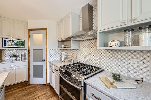 16247 E Belleview Pl, Centennial, CO 80015 - kitchen featuring stainless steel appliances, wall chimney exhaust hood, open shelves, tasteful backsplash, and wood finished floors