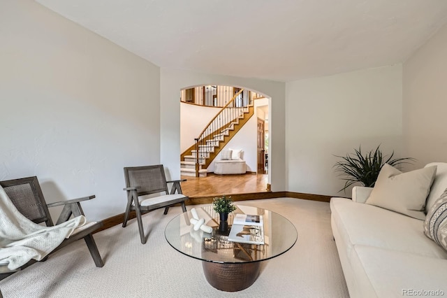 16247 E Belleview Pl, Centennial, CO 80015 - carpeted living room with arched walkways and stairway