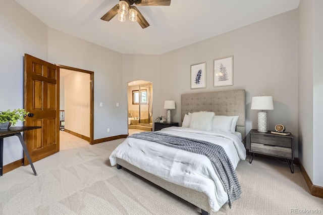 16247 E Belleview Pl, Centennial, CO 80015 - bedroom featuring arched walkways, light carpet, ensuite bath, and a ceiling fan