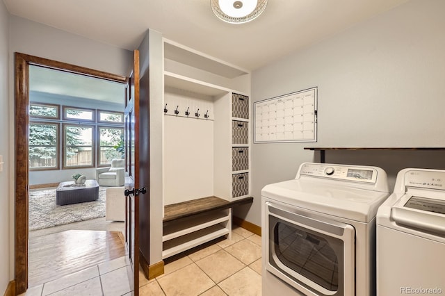 16247 E Belleview Pl, Centennial, CO 80015 - laundry area with independent washer and dryer and light tile patterned flooring