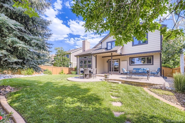 16247 E Belleview Pl, Centennial, CO 80015 - rear view of house featuring a patio and a chimney