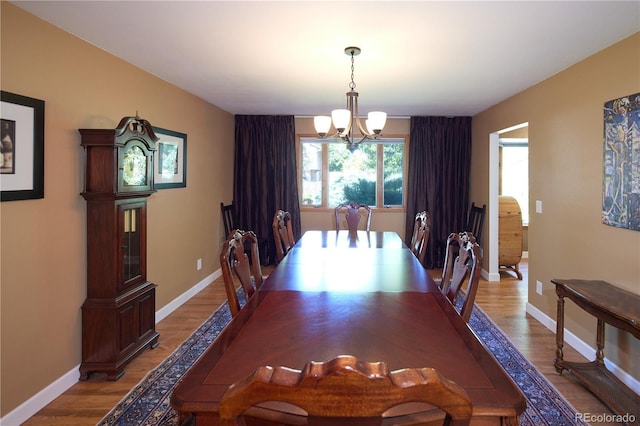 3820 S Harlan St, Denver, CO 80235 - dining space featuring a chandelier and light wood-style flooring
