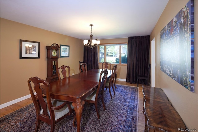 3820 S Harlan St, Denver, CO 80235 - dining area featuring wood finished floors and a chandelier