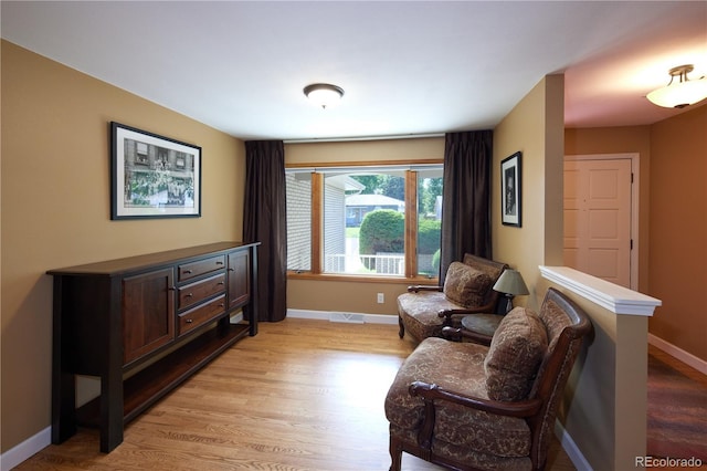 3820 S Harlan St, Denver, CO 80235 - living area with light wood finished floors and baseboards